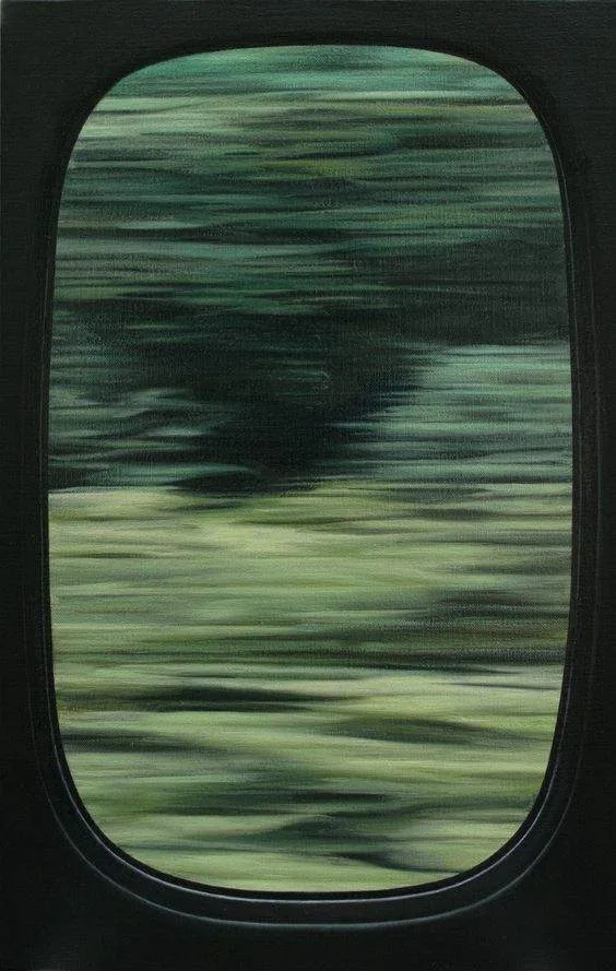 A rounded aircraft window with a blurred, streaking green landscape passing outside.